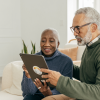 A couple looking at an iPad screen